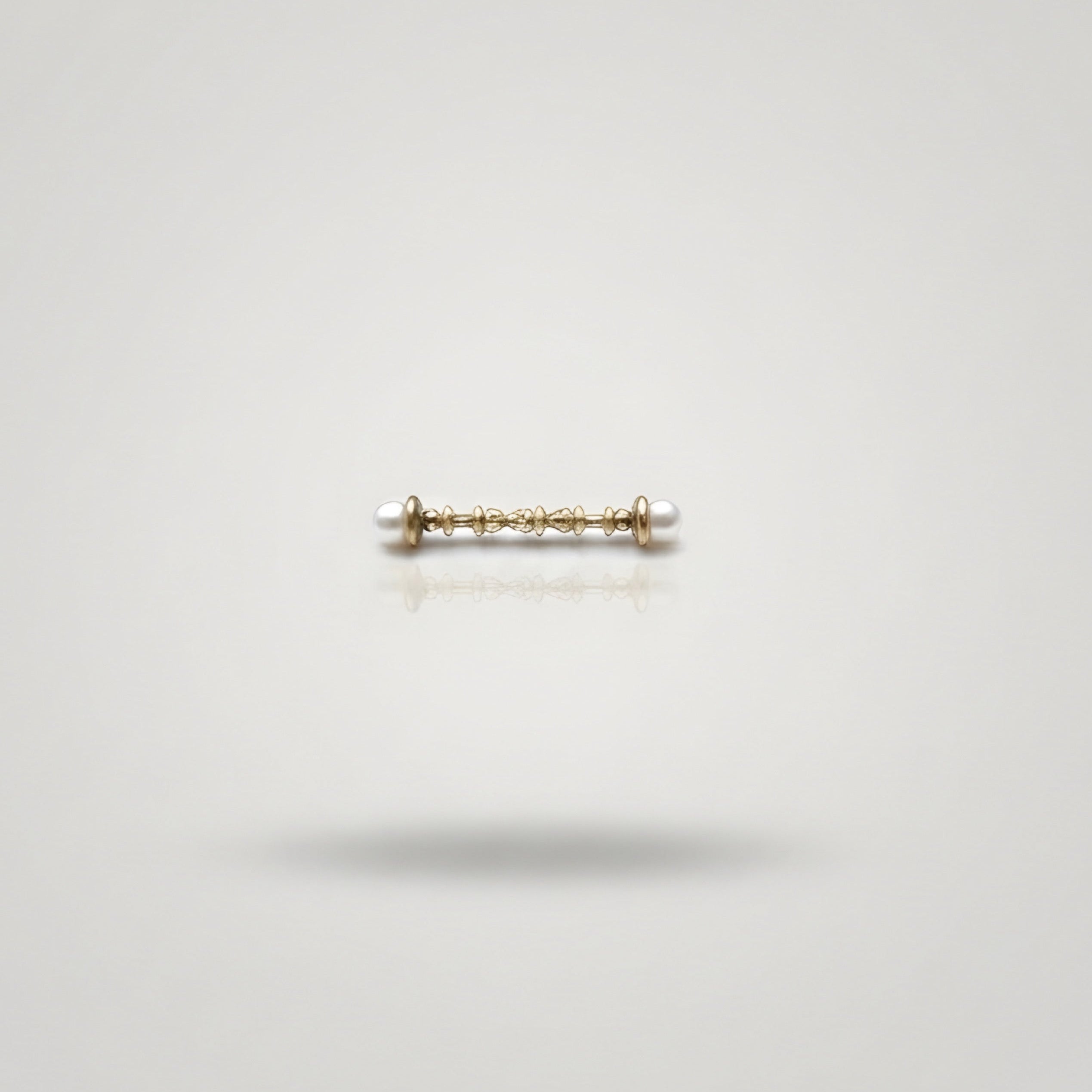 gold earring with pearls
