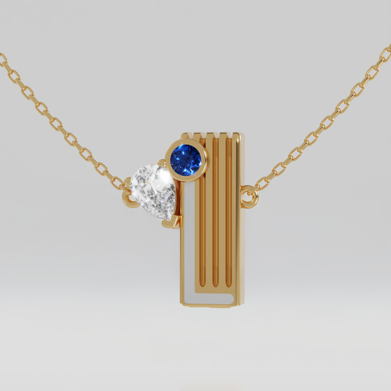 A gold pendant necklace featuring a vertical bar with a side round blue sapphire gemstone and a pear shaped white diamond, suspended from a delicate gold chain against a light gray background. White enamel. 