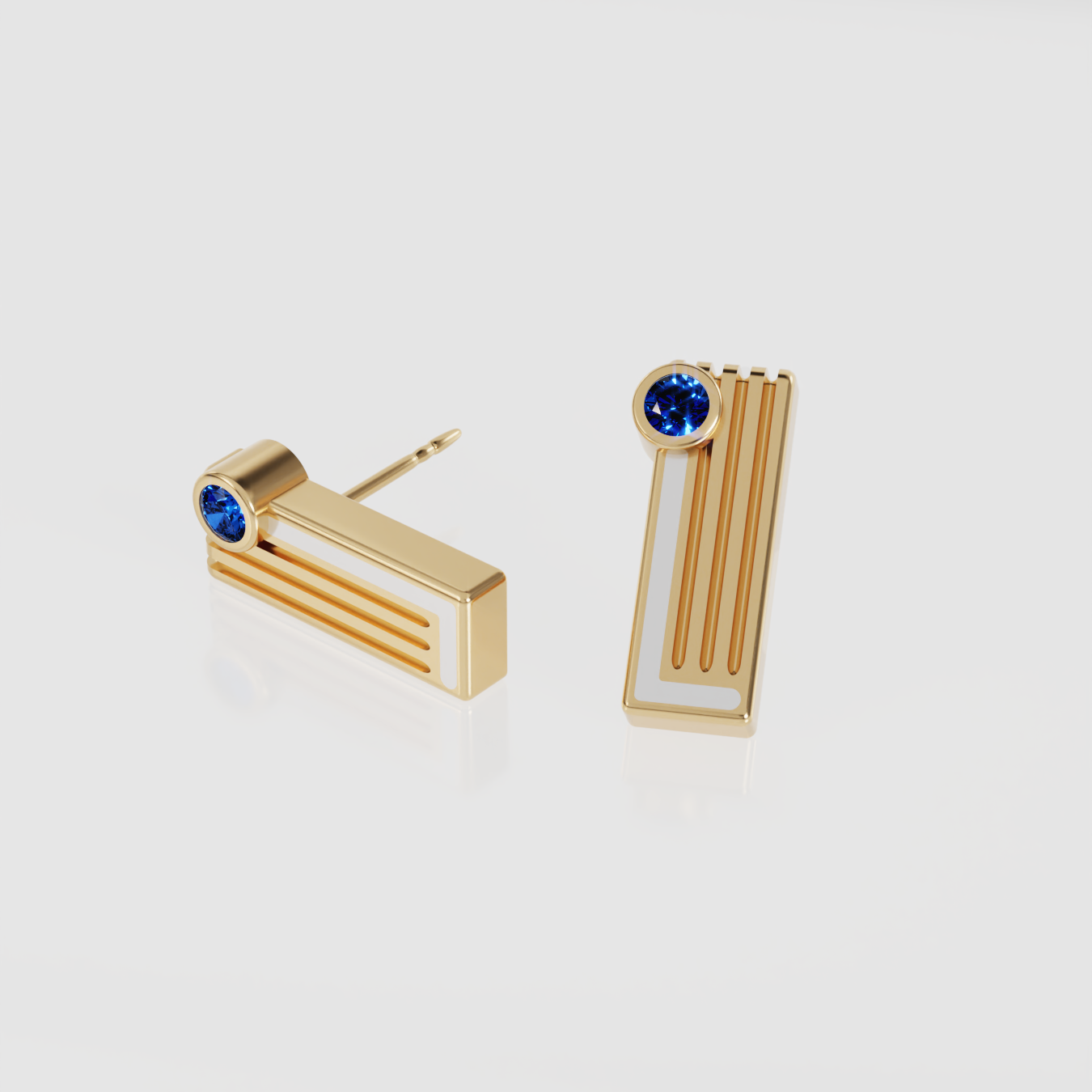 pair of yellow gold geometric bar earrings with white enamel and round deep plue sapphire on light background