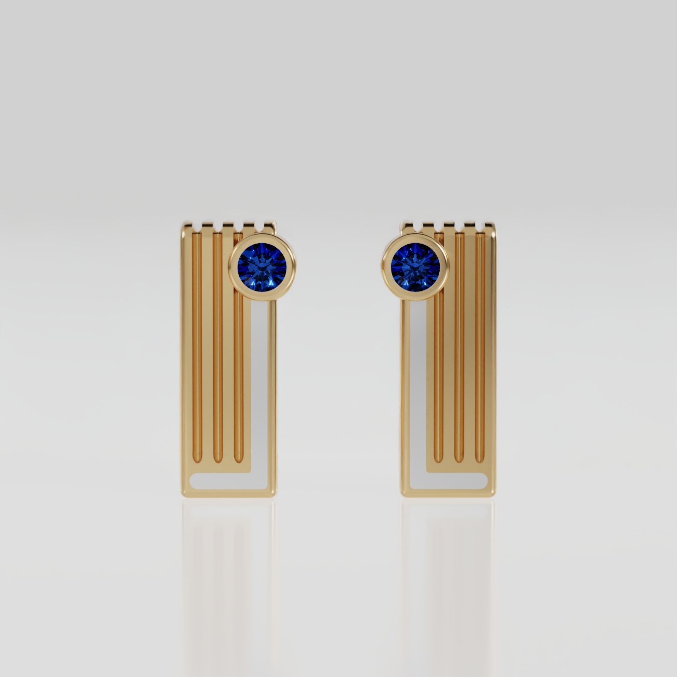 pair of yellow gold geometric bar earrings with white enamel and round deep plue sapphire on light background