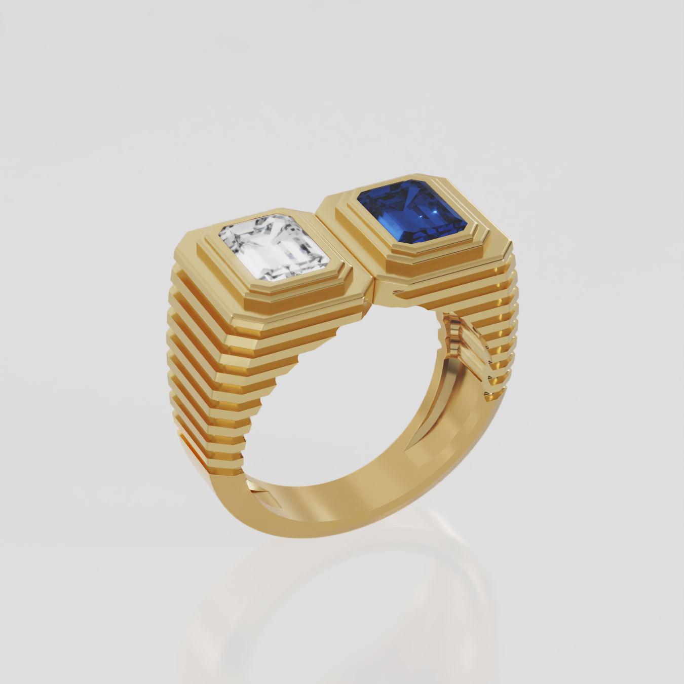 Ribbed  yellow gold ring with emerald cut diamond and blue sapphire