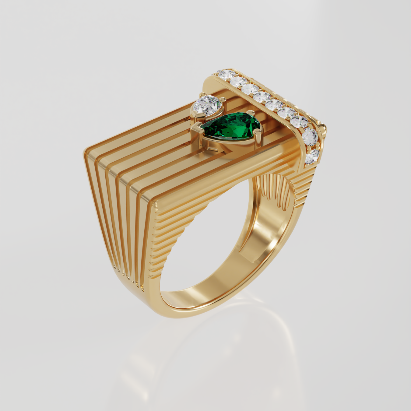 A gold signet ring with a geometric, ribbed rectangular face, featuring two central pear shaped gemstones one emerald and one diamond and a curved row of clear stones along the top, set against a light gray background.
