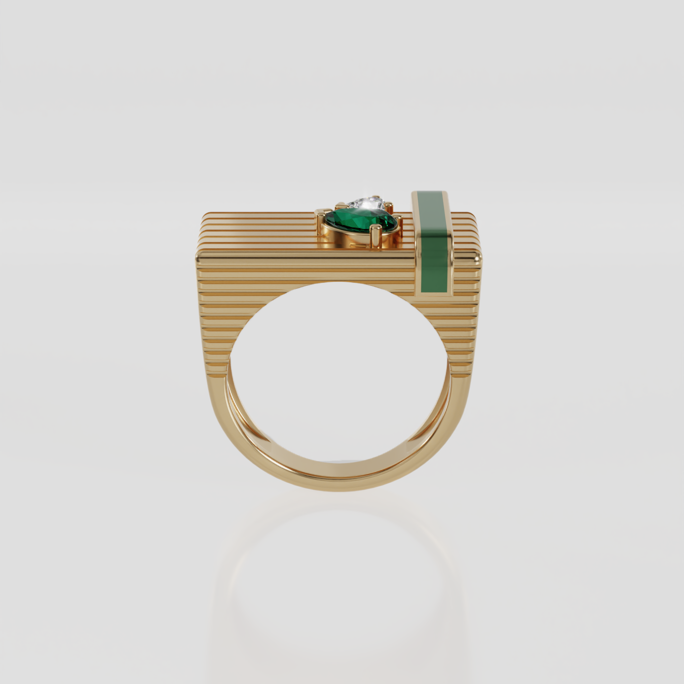 A gold ring with a ribbed rectangular face, featuring a central green oval gemstone and a vertical green enamel stripe, set against a light gray background.